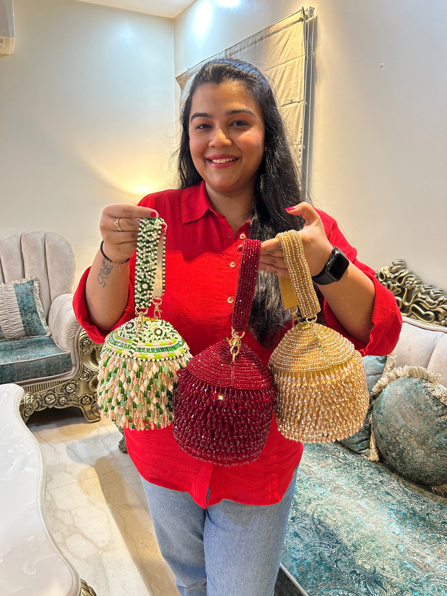 Woman holding three decorative bags in a living room setting